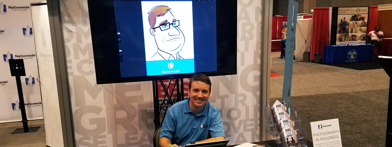 Bax Illustration artist drawing beside a live digital caricature display at a trade show